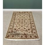 G H FRITH INDO PERSIAN CREAM GROUND RECTANGULAR WOOL RUG - central brown leaf and floral design with