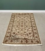G H FRITH INDO PERSIAN CREAM GROUND RECTANGULAR WOOL RUG - central brown leaf and floral design with
