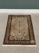 G H FRITH KASHMIRI SILK CREAM RECTANGULAR RUG - busy central floral design with patterned borders
