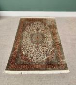 G H FRITH ORIENTAL RECTANGULAR WOOL RUG - central cream and red floral design with patterned borders
