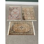 G H FRITH KASHMIRI SILK RECTANGULAR RUGS (3) - all having various patterned centres and borders with