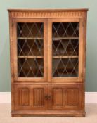 VINTAGE OAK BOOKCASE - Priory style having twin upper leaded lattice glazed doors and interior