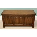 PRIORY OAK STYLE BLANKET CHEST - rectangular lift-up top above a three panelled front with carved
