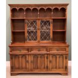 OLD CHARM REPRODUCTION OAK DRESSER with arched and baluster support gallery top shelf, above twin