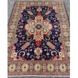 TABRIZ RUG, striking blue and red ground with super quality central panel pattern and continuous