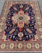 TABRIZ RUG, striking blue and red ground with super quality central panel pattern and continuous