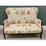 EDWARDIAN RE-UPHOLSTERED TWO SEATER COUCH, light beige with large colourful floral detail, shaped to