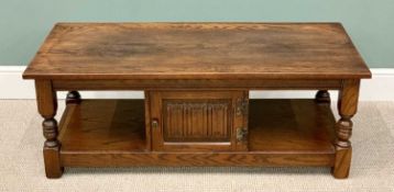 OLD CHARM REPRODUCTION OAK COFFEE TABLE, rectangular top and lower shelf with central cupboard door,