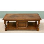 OLD CHARM REPRODUCTION OAK COFFEE TABLE, rectangular top and lower shelf with central cupboard door,