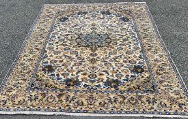 NAJAF ABAD RUG, tonal cream ground with fine quality floral and other motifs, central roundel and