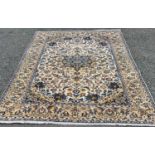 NAJAF ABAD RUG, tonal cream ground with fine quality floral and other motifs, central roundel and