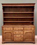 CIRCA 1830 OAK WELSH DRESSER, the three-shelf rack with wide backboards and shaped front detail over