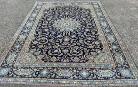 FINE KASHAN RUG, blue ground with stunning central panel of traditional motifs and decorative