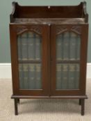 VINTAGE STAINED OAK STANDING BOOKCASE & CONTENTS, having a three quarter railback top over twin