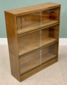 VINTAGE OAK THREE-SECTION STACKING BOOKCASE with sliding front door on a plinth base, 106cms H,