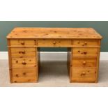 REPRODUCTION PINE TWIN PEDESTAL DESK, having nine opening drawers, 74cms H, 140cms W, 70cms D