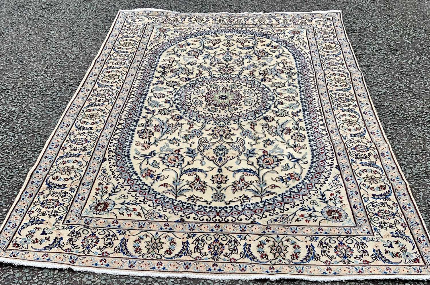 FINE NAIN RUG, cream ground with extensive floral pattern, the central block having a traditional
