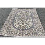 FINE NAIN RUG, cream ground with extensive floral pattern, the central block having a traditional