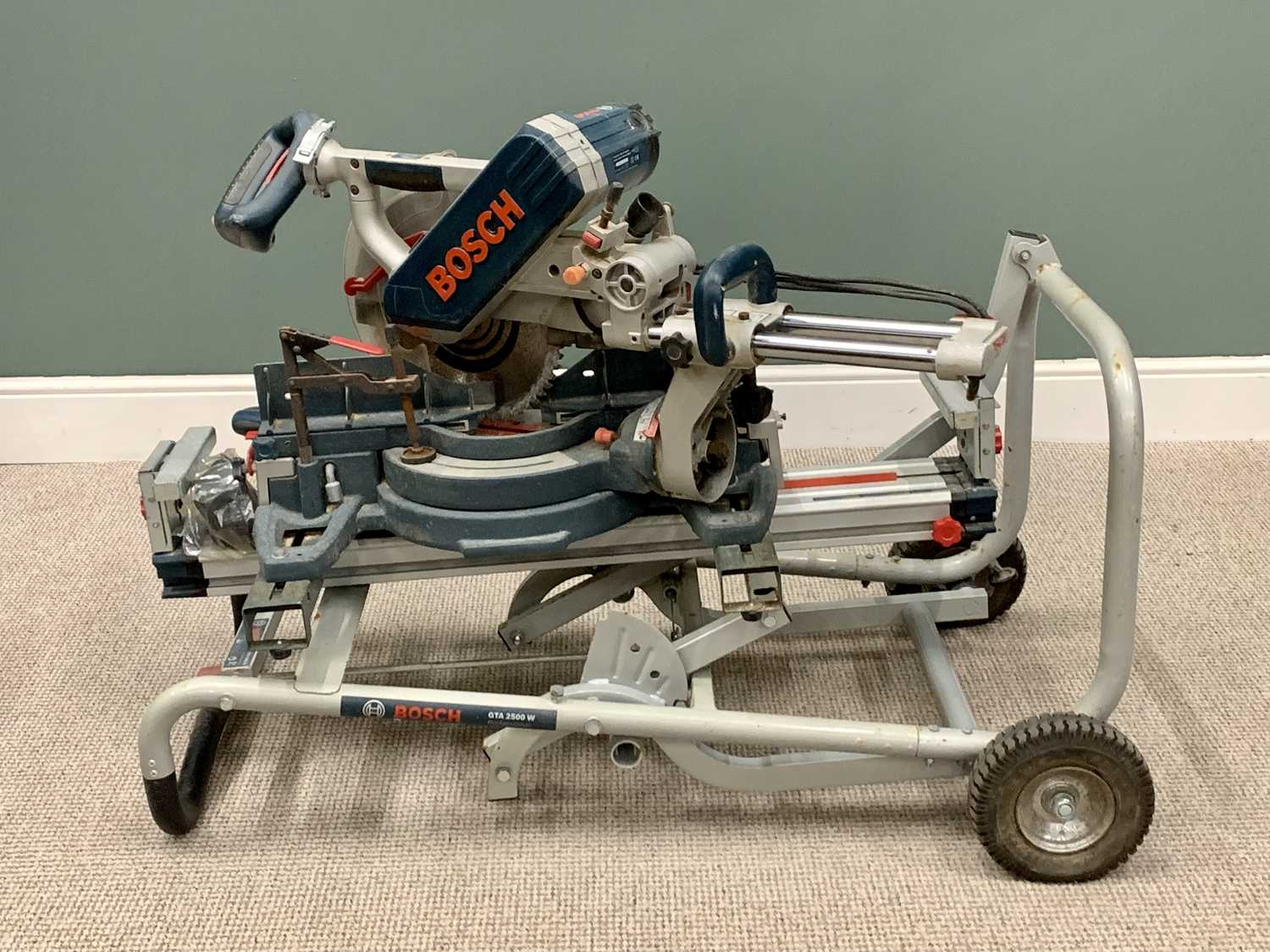 WORKSHOP EQUIPMENT - BOSCH GCM12 SD CIRCULAR CHOP SAW, on a Bosch trolley, 90cms H, 120cms W,