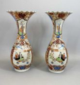JAPANESE IMARI VASES, A PAIR - with ovoid bodies, slender necks and flared crimped rims, panels