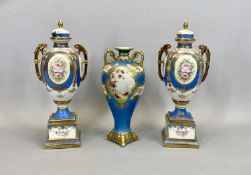 NORITAKE TWIN HANDLED LIDDED VASES, A PAIR - baluster shaped bodies having oval painted panels of