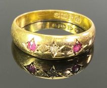 CHESTER 18CT GOLD GYPSY SET DIAMOND & RUBY 3 STONE RING - star set central diamond, 0.02cts and