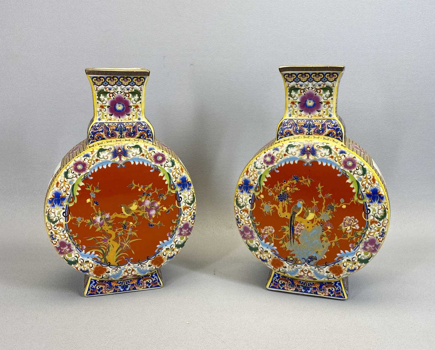CHINESE PORCELAIN MOON FLASK VASES, A PAIR - 20th century, decorated enamels with central panels