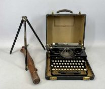 VINTAGE CASED TYPEWRITER BY ROYAL and a vintage leather cased metal tripod stand