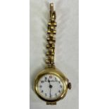LADY'S VINTAGE 15CT GOLD CASED WRISTWATCH - on rolled gold bracelet, the white dial marked 'Thomas