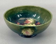 MOORCROFT CIRCULAR FOOTED BOWL - leaf and berry pattern, impressed marks to the base, 8.5cms H, 13.