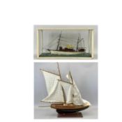 MODEL YACHT IN A GLASS CASE 'ALEXANDRA', 32cms H, 60cms W, 19cms D and a pond yacht on a stand,