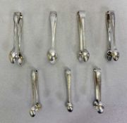 SHEFFIELD SILVER SUGAR TONGS - a collection of seven, all having individual bright cut and other