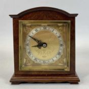 ELLIOT MAHOGANY CASED DOME TOP MANTEL CLOCK - gilt dial with cherub spandrels and silvered chapter
