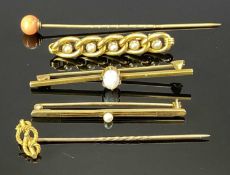 15CT GOLD STAMPED BAR BROOCHES & A STICK PIN - one brooch set with a single oval opal, claw