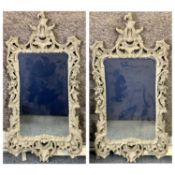 LARGE FANCY ORNATE WALL MIRRORS, A PAIR - in painted composition frames, 151 x 73cms