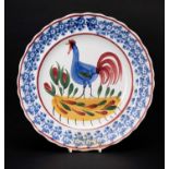 LLANELLY POTTERY COCKEREL PLATE circa 1900, continuous sponged floral border in blue, the interior