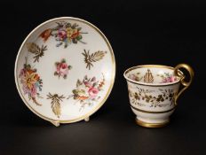 NANTGARW PORCELAIN COFFEE CUP & SAUCER painted with sprays of summer flowers between gilt