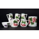 LLANELLY POTTERY GROUP comprising pair of cherry decorated tapered vases, 15cms high, similar with