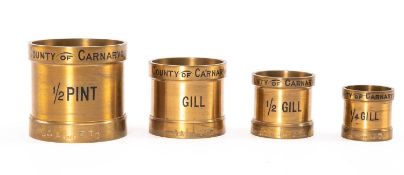SET FOUR BRASS 'COUNTY OF CARNARVON' IMPERIAL FLUID MEASURES by W. & T. Avery Ltd., comprising 1/2