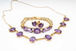 14K GOLD COLOUR CHANGE CORUNDUM PARURE comprising seven stone necklace, five stone bracelet and pair