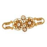 14K GOLD DIAMOND BAR BROOCH of double flowerhead design, set with old and rose cut diamonds, foliate
