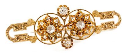 14K GOLD DIAMOND BAR BROOCH of double flowerhead design, set with old and rose cut diamonds, foliate