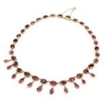 19TH CENTURY GARNET FRINGE NECKLACE, the foil backed stones set in closed back settings with pinched