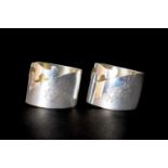 PAIR IMPERIAL RUSSIAN 'AESTHETIC' SILVER NAPKIN RINGS, c. 1910, engraved with 'MCN' and 'EN'