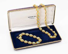 18CT GOLD & TURQUOISE JEWELLERY SUITE comprising necklace and bracelet designed as flowerhead panels