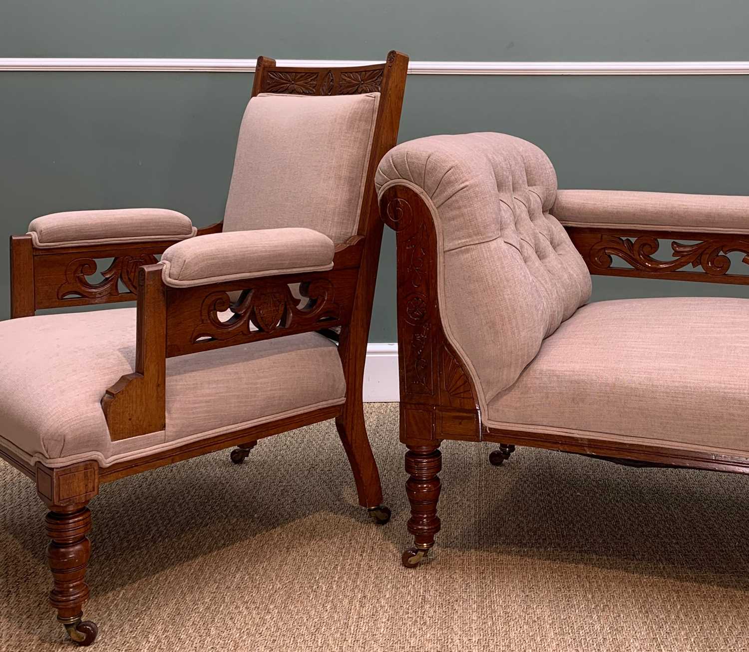 MATCHING VICTORIAN WALNUT CHAISE LONGUE & ARMCHAIR, with carved arms, on brown ceramic castors,
