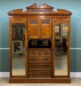 JAMES SHOOLBRED WALNUT COMPACTUM, c. 1900, carved cornice above twin mirrors flanking carved