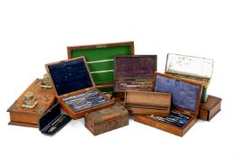 ASSORTED BOXES comprising four fitted drawing instrument sets, brass bound dome jewellery casket,