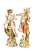 LARGE PAIR ROYAL DUX PORCELAIN FIGURES, c. 1900, of elegant lady and gentleman musician in