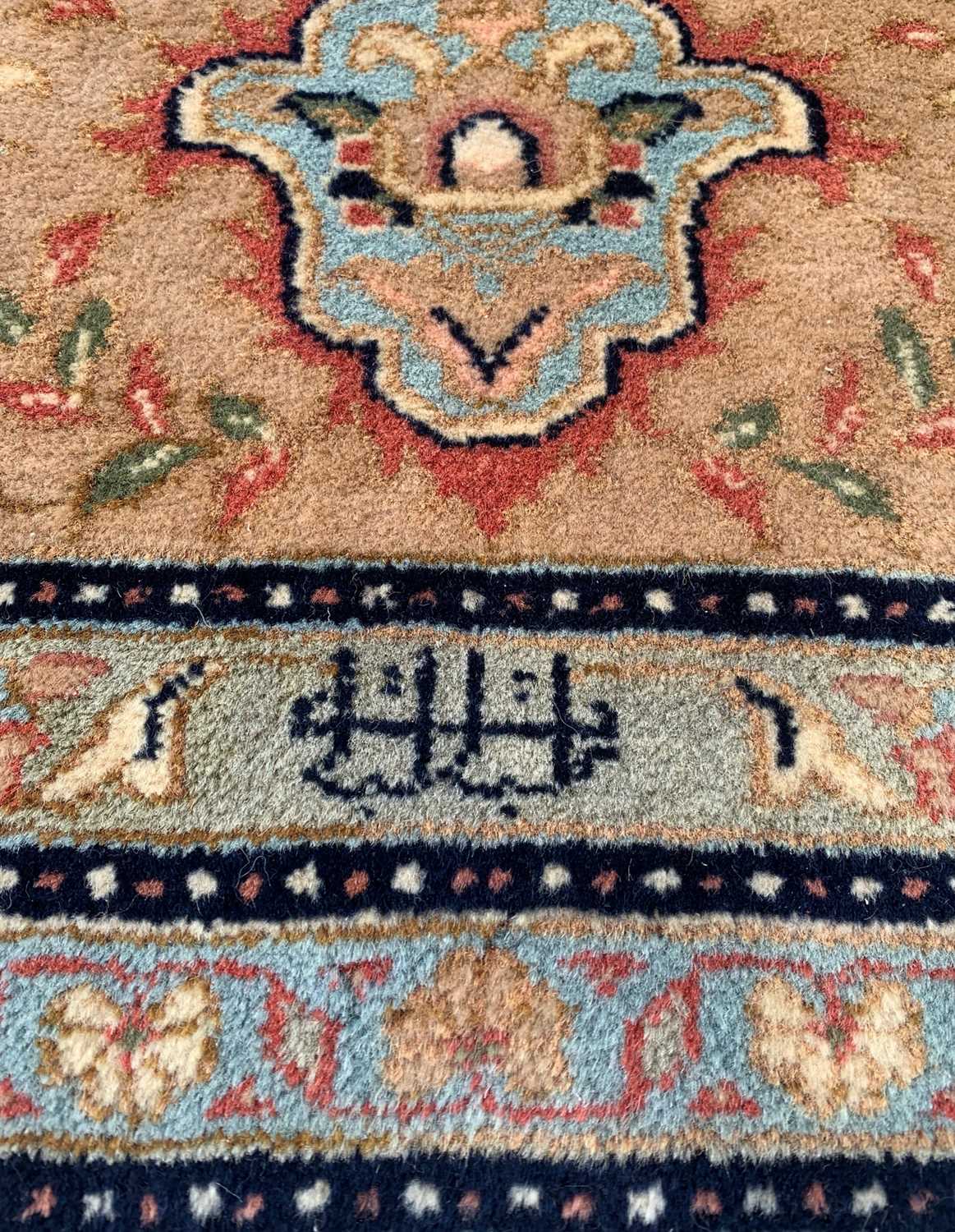 MODERN ORIENTAL CARPET, red central medallion with mosque lamps, on a dark field with floral ivory - Image 3 of 7